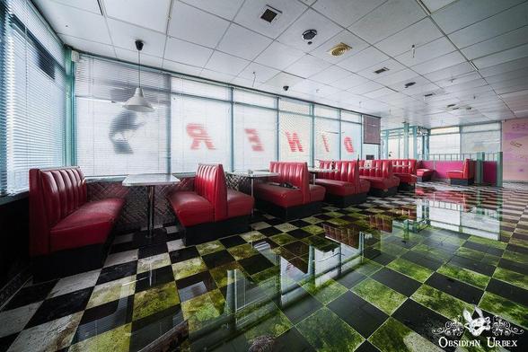 an old Americans style diner with red booth seating, the floor is flooded