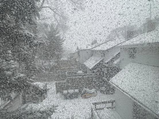 Another scene of a winter storm in Toronto photographed through a window encrusted with tiny bits of ice.