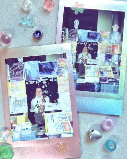 a photo of two instant photos showing Dinchen at her booth, surrounded by a bunch of pearl beads