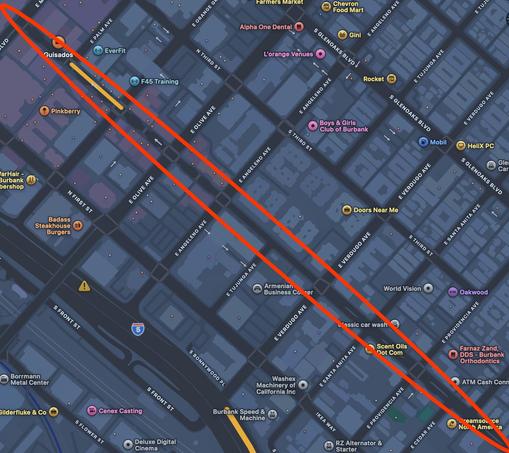 A still from Apple Maps. A street running diagonally top left to bottom right is circled with a red oval. The street runs for about 01 blocks. Maps does not label the street, so there is no way to know its name.