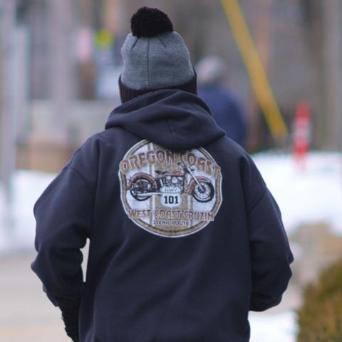 Expand this 1:1 crop to appreciate the amount of detail captured on the hoodie, from over two blocks away.