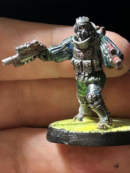 Another with two guns and a gas mask