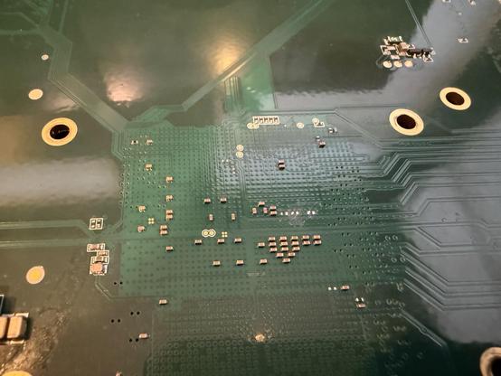 Close up of three removed decoupling capacitors under the BGA