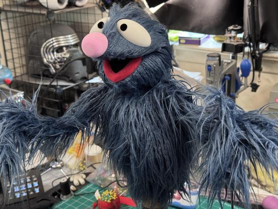 A Grover like monster puppet, full left view