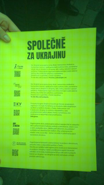 Short distance photo of the proclamation text and #Czech #Ukraine support initiatives QR codes