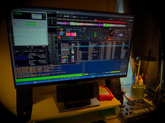 photo of my computer display showing mixxx, butt, etc running on xfce4/debian13