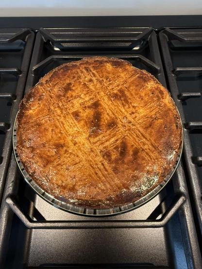 A fresh-from-the-oven Breton Butter Cake on my stovetop, cooking slightly before slicing.