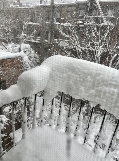 View of my fire escape and looking down towards the center garden. Tons of snow.