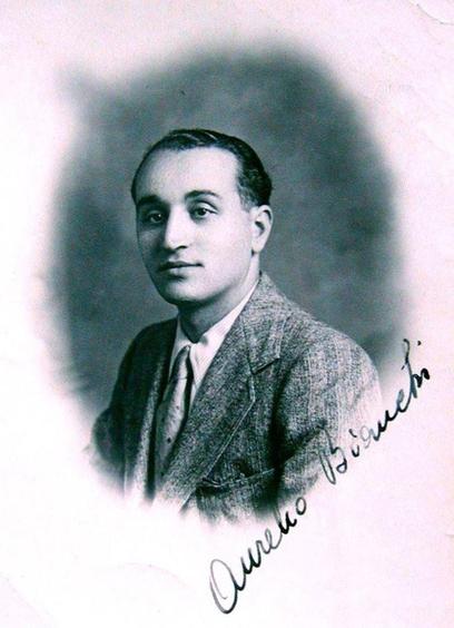 Black and white portrait of a man, featuring a formal, head-and-shoulders view, with a signature at the bottom.