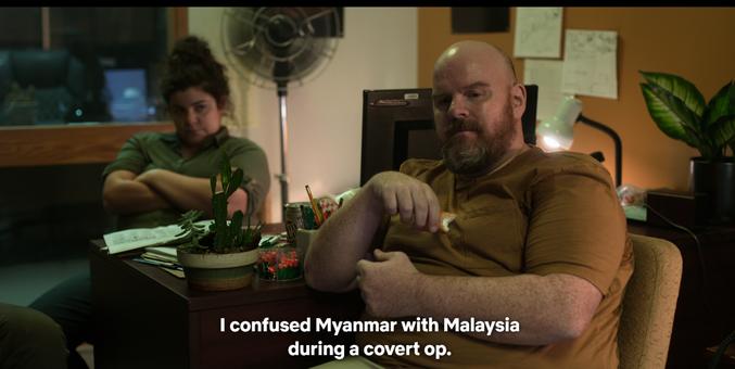 A man who looks a little like he has given up on life, wearing a polo shirt (although he works at an insitution where most people wear suits), explains he is based at this dependence of the CIA because "I confused Myanmar with Malaysia during a covert op"