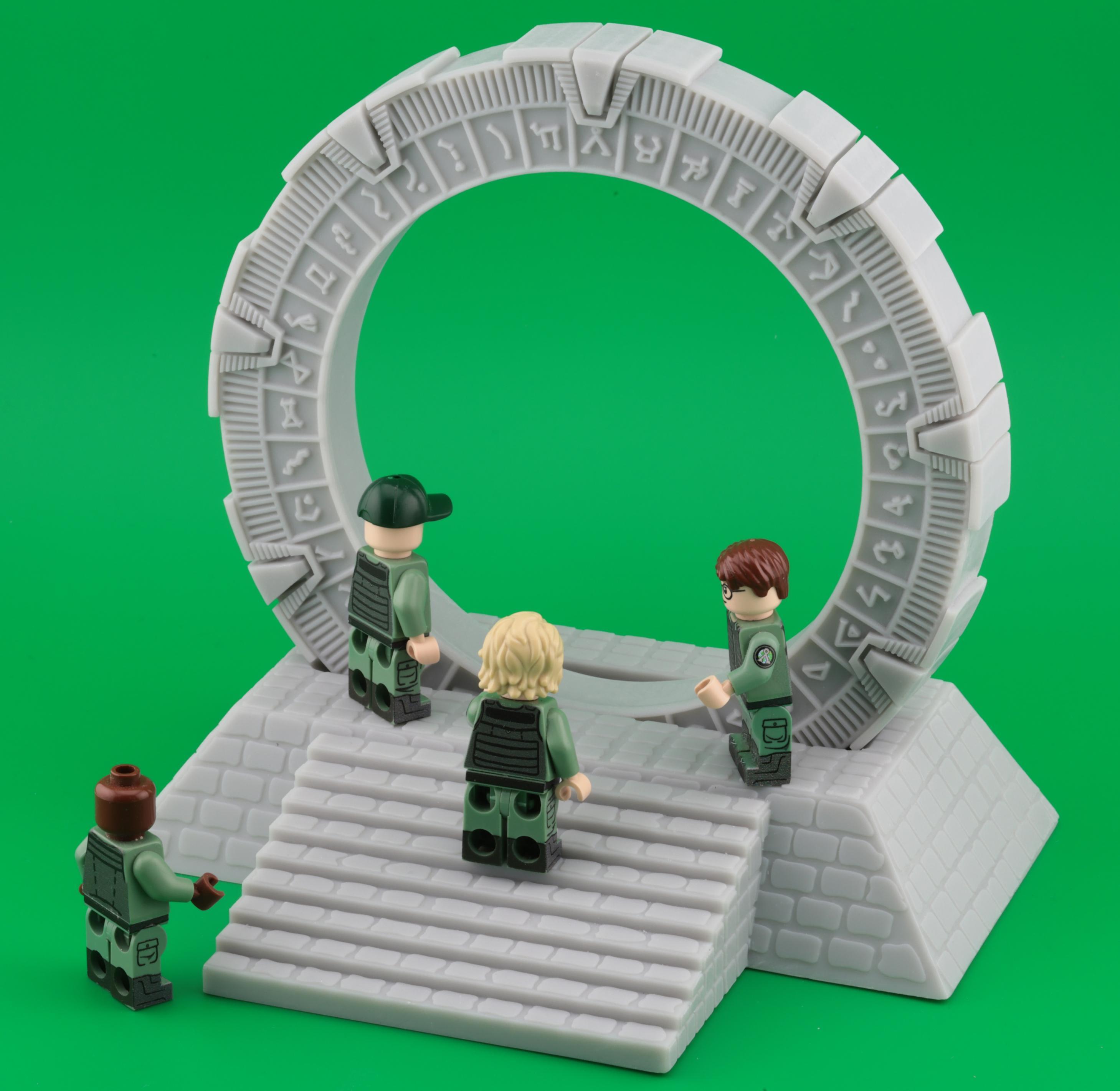 A group of four action figures in military-style outfits interact near a large, circular stone gate with intricate carvings. The background is a vibrant green. “This gate, …, is plastic”