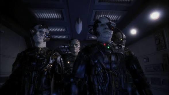 Three Borg walking down a corridor