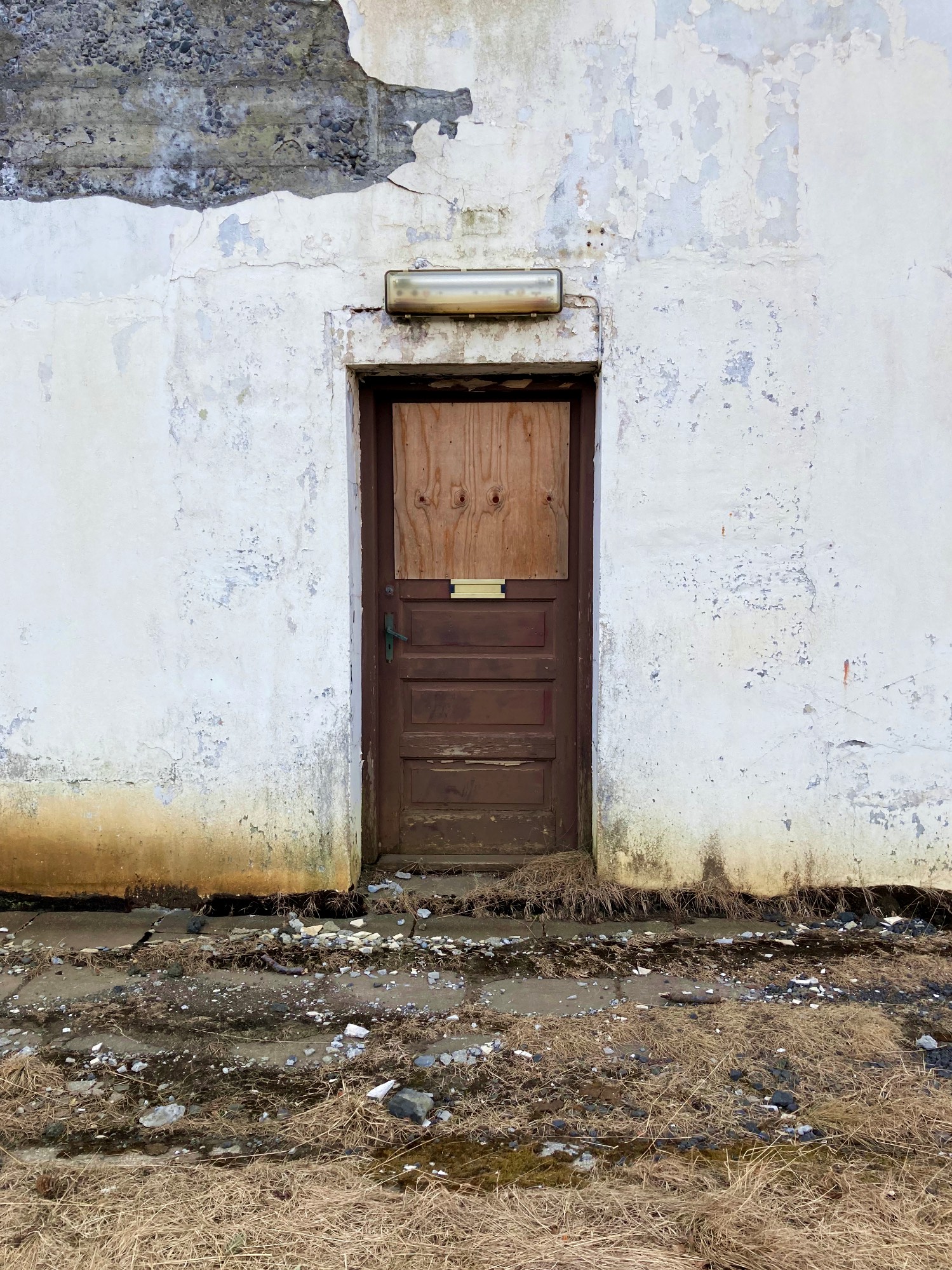 A door to an abandoned house.
