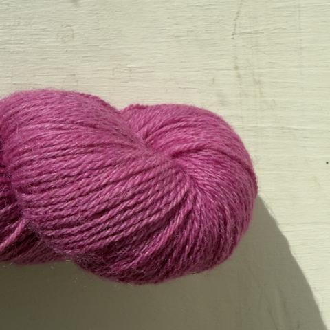 macro view of bright pink yarn