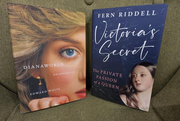 The books "Dianaworld - An Obsession" by Edward White and "Victoria's Secret" by Fern Riddell propped up on a green chair