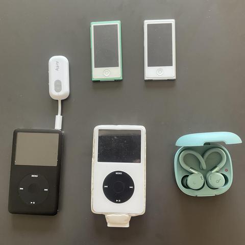 Apple iPods. Two 7th Gen Nanos and a pair of Classics. Also a Bluetooth adapter and Anker earbuds.