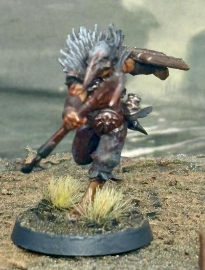 A heretic trooper with sword and shield, wearing a crow mask.