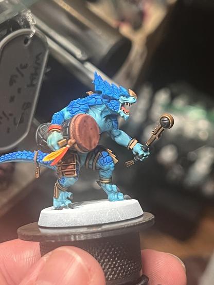 The last wip Seraphon mini for this post. This warrior is carrying a large drum and mallet into battle, surely helping keep its brethren in step while demoralizing the opposing army. Aside from the lizard man having blue scales and gold adornments like the others, the drum is also accented with vibrant feathers.
