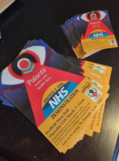 A photo of newly printed posters and leaflets for the upcoming Demo against Palantir in the NHS on the 12th for March. They look very pretty.