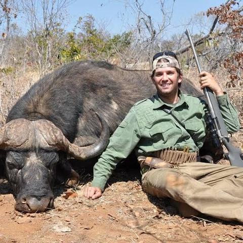 Don Jr With gun and  dead buffalo he shot
