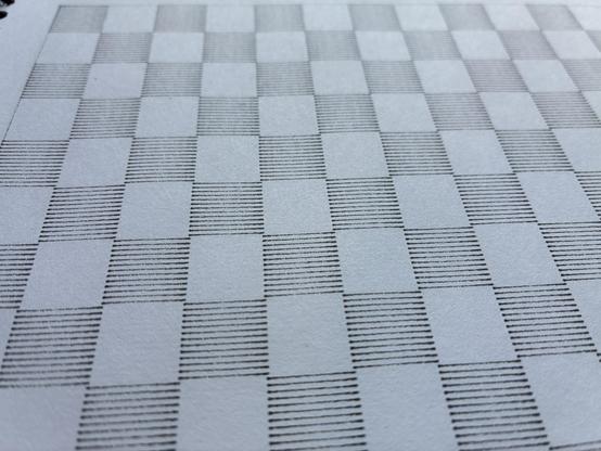 A close up view of a checkerboard pattern from a slightly skewed angle