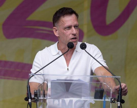 Peter Thiel makes speech from tribune with mikes