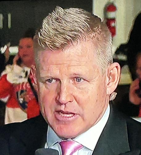 Former Detroit Red Wing and FanDuel Sports broadcaster Chris Osgood. He’s wearing a suit and a tie and he has a cool haircut.