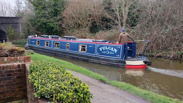 A shared owner narrowboat about to pass under Preston Brook #bridge on the Bridgewater Canal.