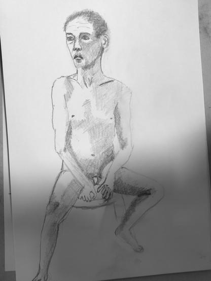 Drawing portrait of a naked male art model