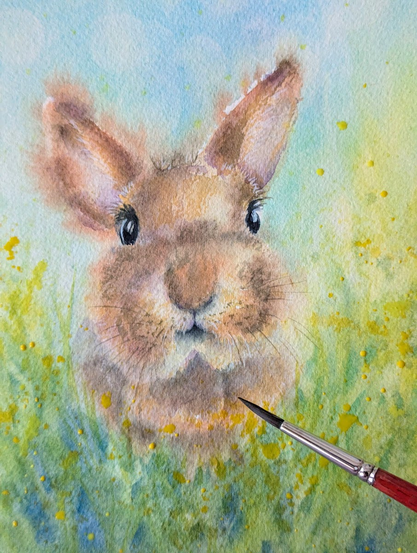 Work in porgress shots of my new bunny portrait - A cute rabbit with brown fur sits in a green meadow under a blue sky. It looks curiously out from among yellow wildflowers towards the viewer.