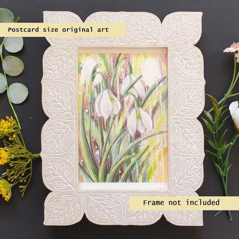 A small colour drawing of white snowdrops with a painterly style. They have green stems and a multi hued background in darker tones to bring out the white of the flowers.
An original art work, please note that the frame is not included.
Colour pencil on white acid free artist watercolour paper (postcard size).
Approximately 4 by 6 inches (10.16 x 15.24 cm) will fit into a standard 4 by 6 inch photo frame.