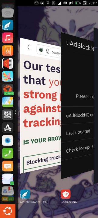 screenshot of ubuntu touch.
desktop is seen and in the middle, switching from app where browser app and adblocker app are shown.
On the left side the dock and the ubuntu logo.