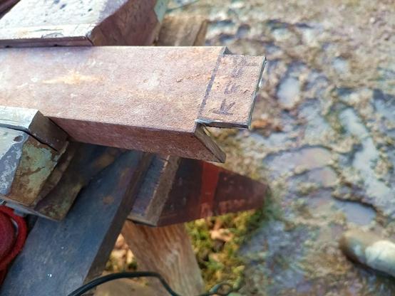 A chunk of C-beam with two angled cuts on the side and a tang sticking out that is labeled "Keep".