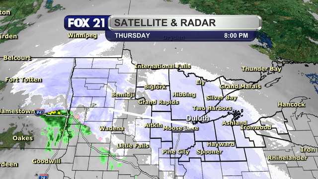 The radar over the Northland at northern Minnesota at 8 p.m. on March 13, 2026, shows two clusters of snow showers pushing from west to east across the region. Some of the snowfall is at a rate around and over 1-inch per hour.