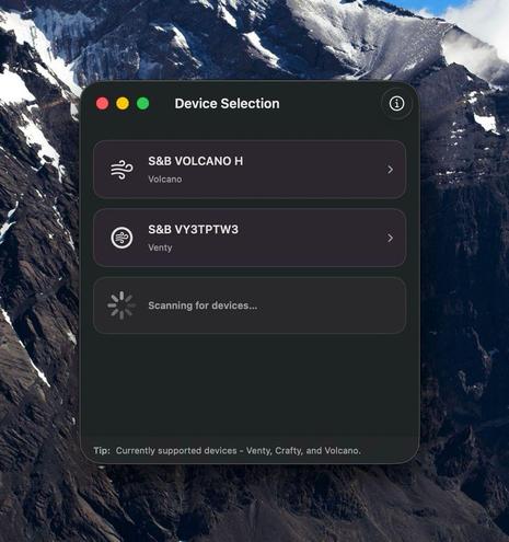 A macOS desktop with a dramatic mountain wallpaper showing the sbcontrol app’s Device Selection window. The interface lists nearby supported devices including S&B Volcano H and S&B VY3TPTW3 (Venty), with a loading indicator showing that the app is scanning for additional Bluetooth devices.