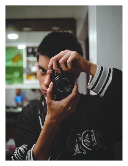 A camera mirror self-portrait.