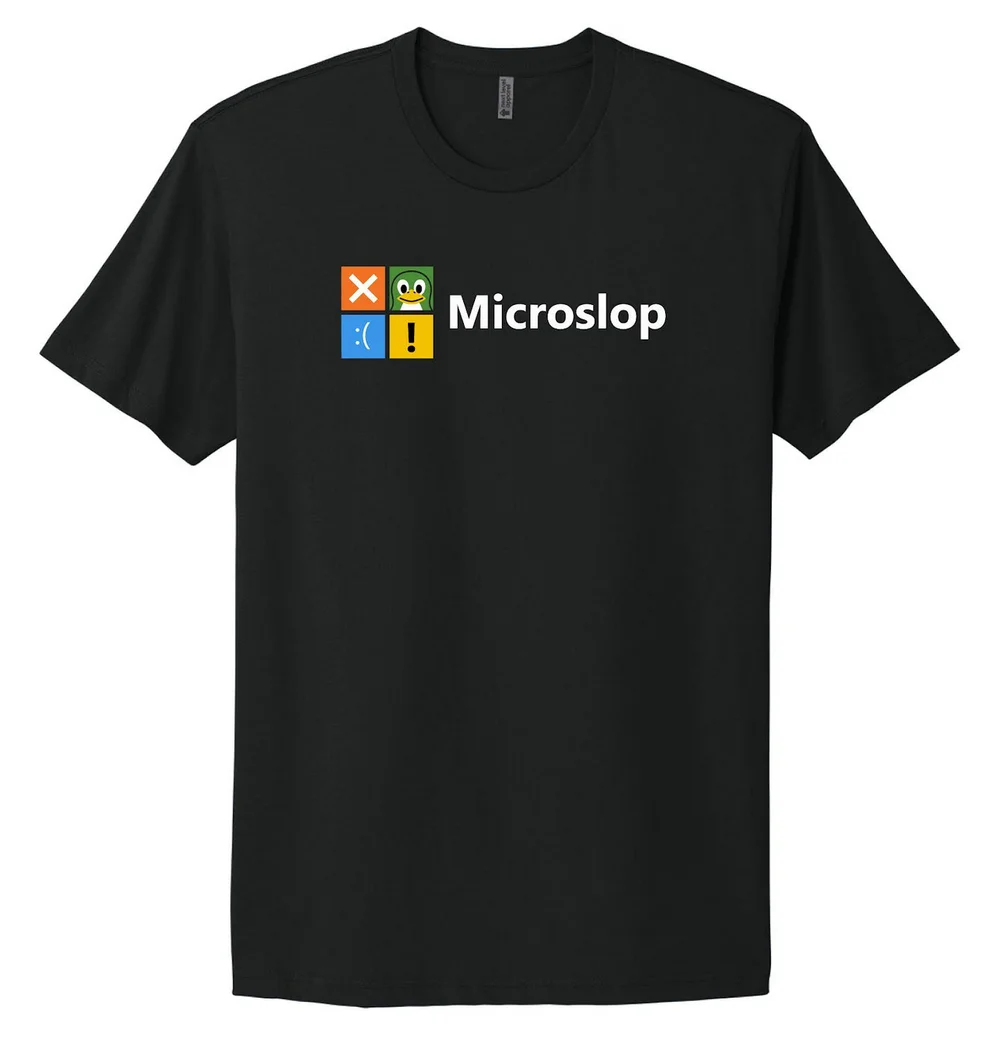 The MICROSLOP T-Shirt is styled with a slop-like parody logo, featuring a BSOD (Blue Screen of Death) frowny face error icon, two event viewer icons (red X and yellow !), and our rendition of a 2D Tux the Penguin as people eye a possible move to Linux from MICROSLOP and its sloppy AI-infused operating system. The shirt comes in a comfortable, 100% cotton and is ready to adhere to Microsoft’s CEO’s cry for everyone to stop referring to AI slop as, well, “slop.” Unlike AI output from Microslop, this shirt is designed by people.