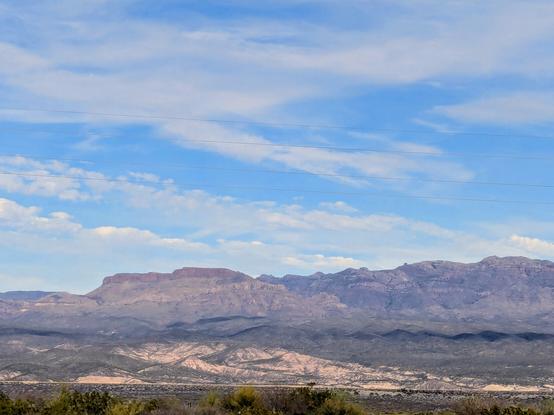 Sombrero Butte and the Galiuro mountains under a blue afternoon sky