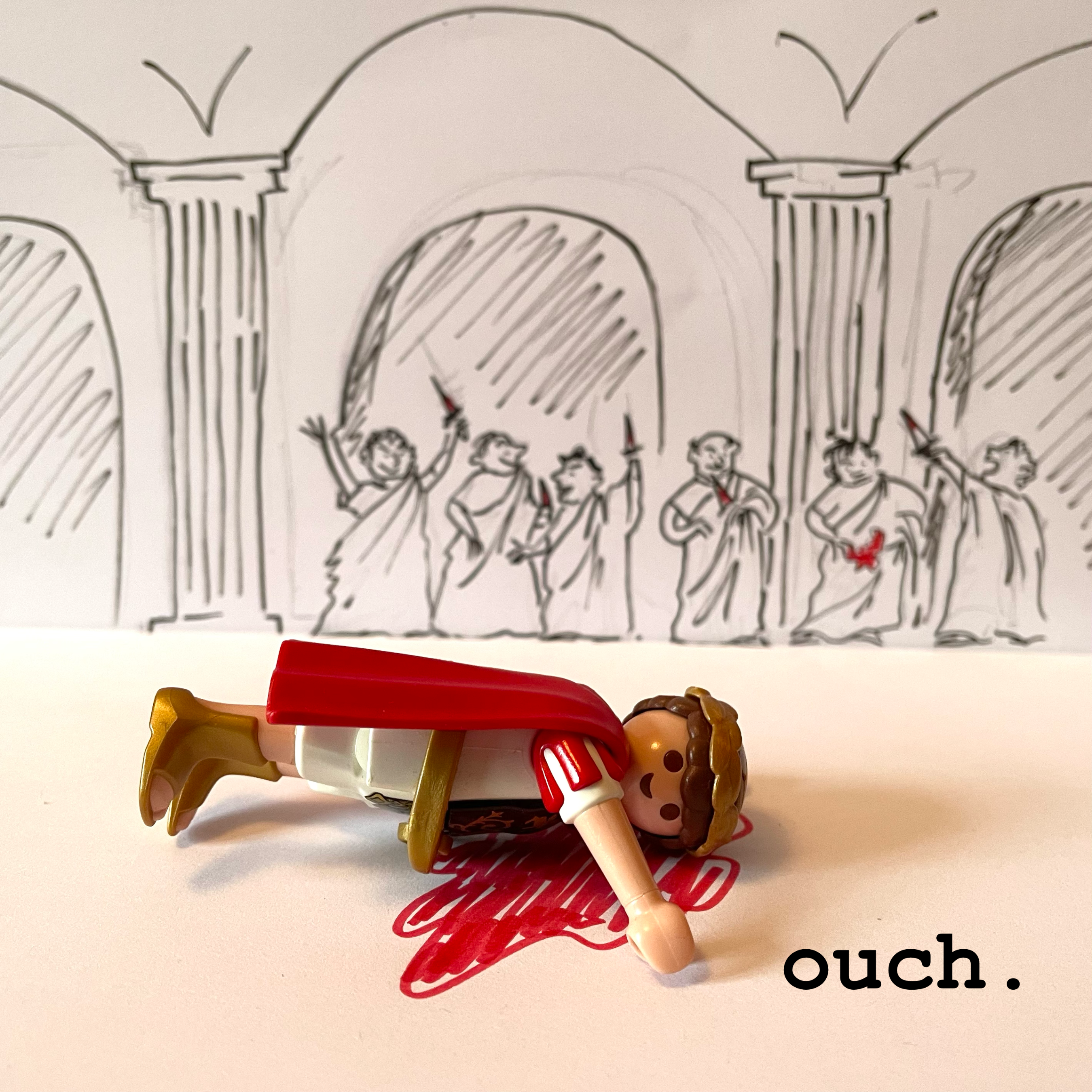 Photo of assassinated Julius Caesar, playmobil version, with a hand-drawn backdrop of conspirators