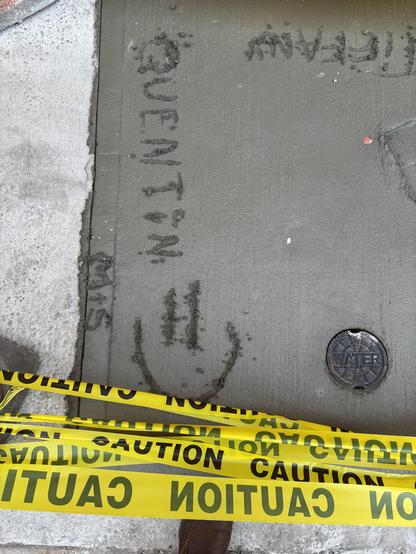 Yellow police tape protect a square of fresh concrete. Quentin was already here,
The smiley face is new.