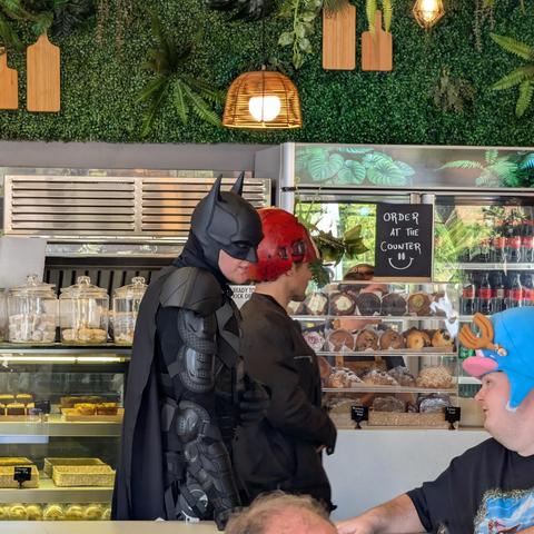 shot from Sydney ComicCon 2025 where Batman walked into a bakery