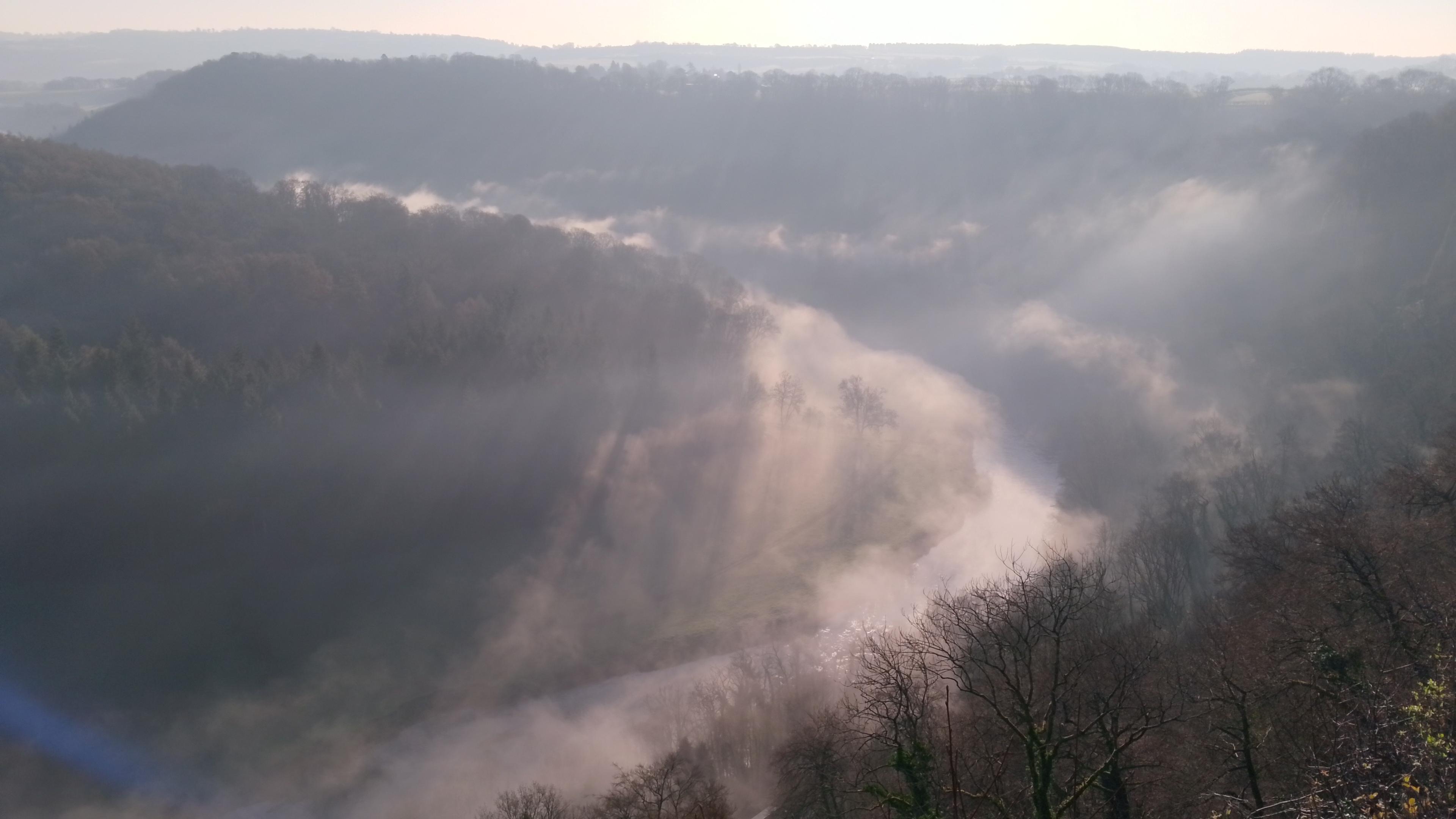 A wider view from a misty mountain top.