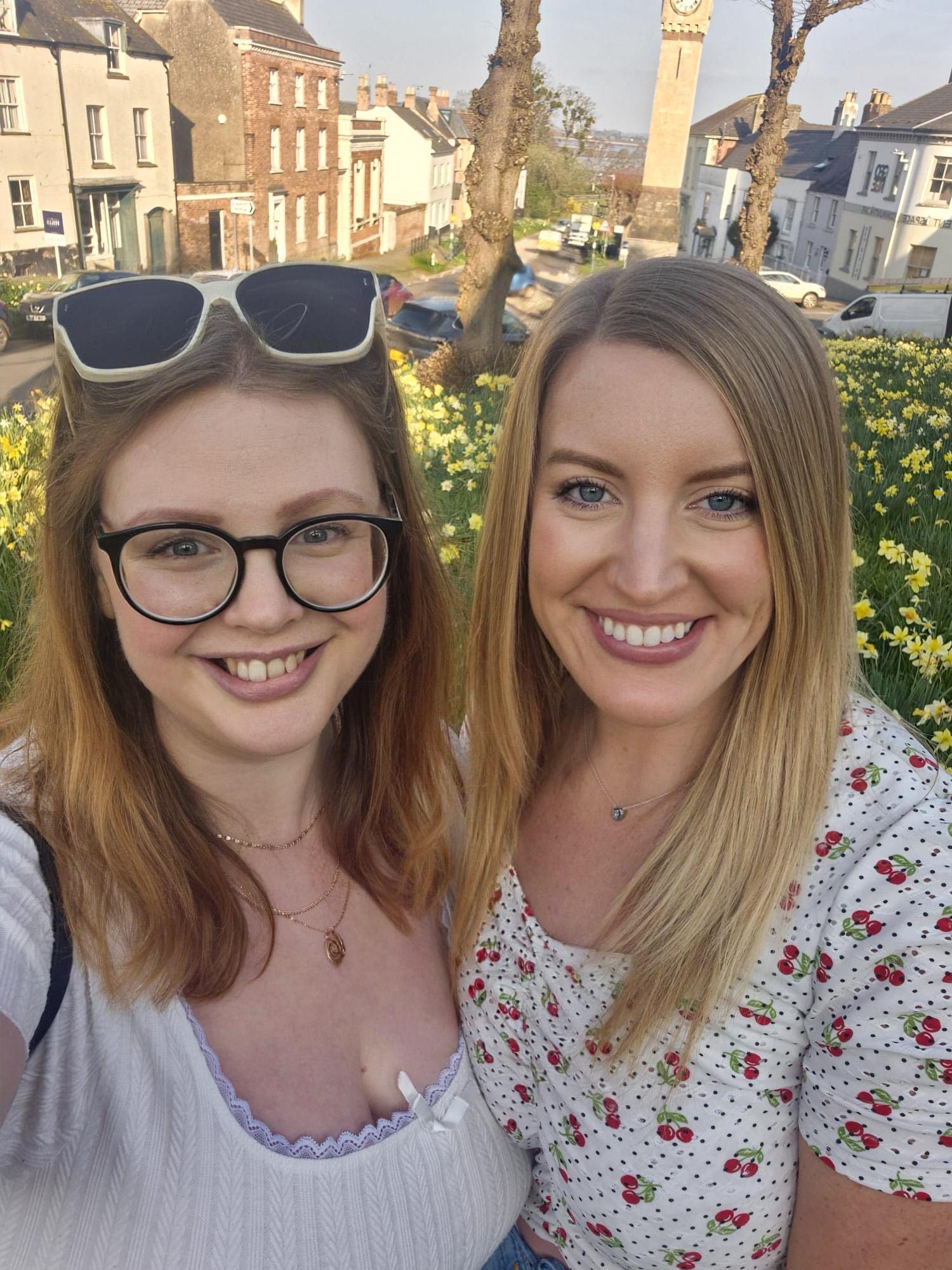 Rosie and her friend, smiling by some daffodils. Really daffodil-heavy post this one
