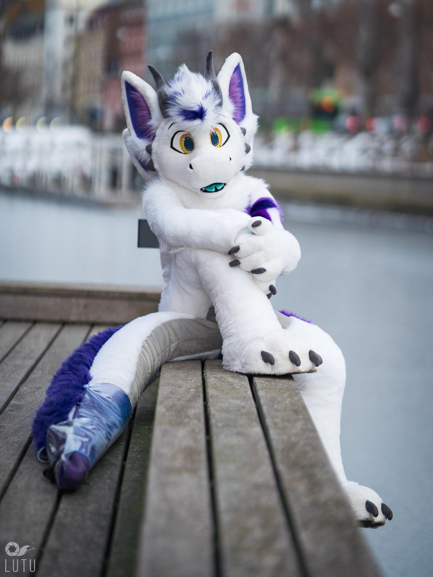 Me sitting in my Fursuit, next to the river in Malmö