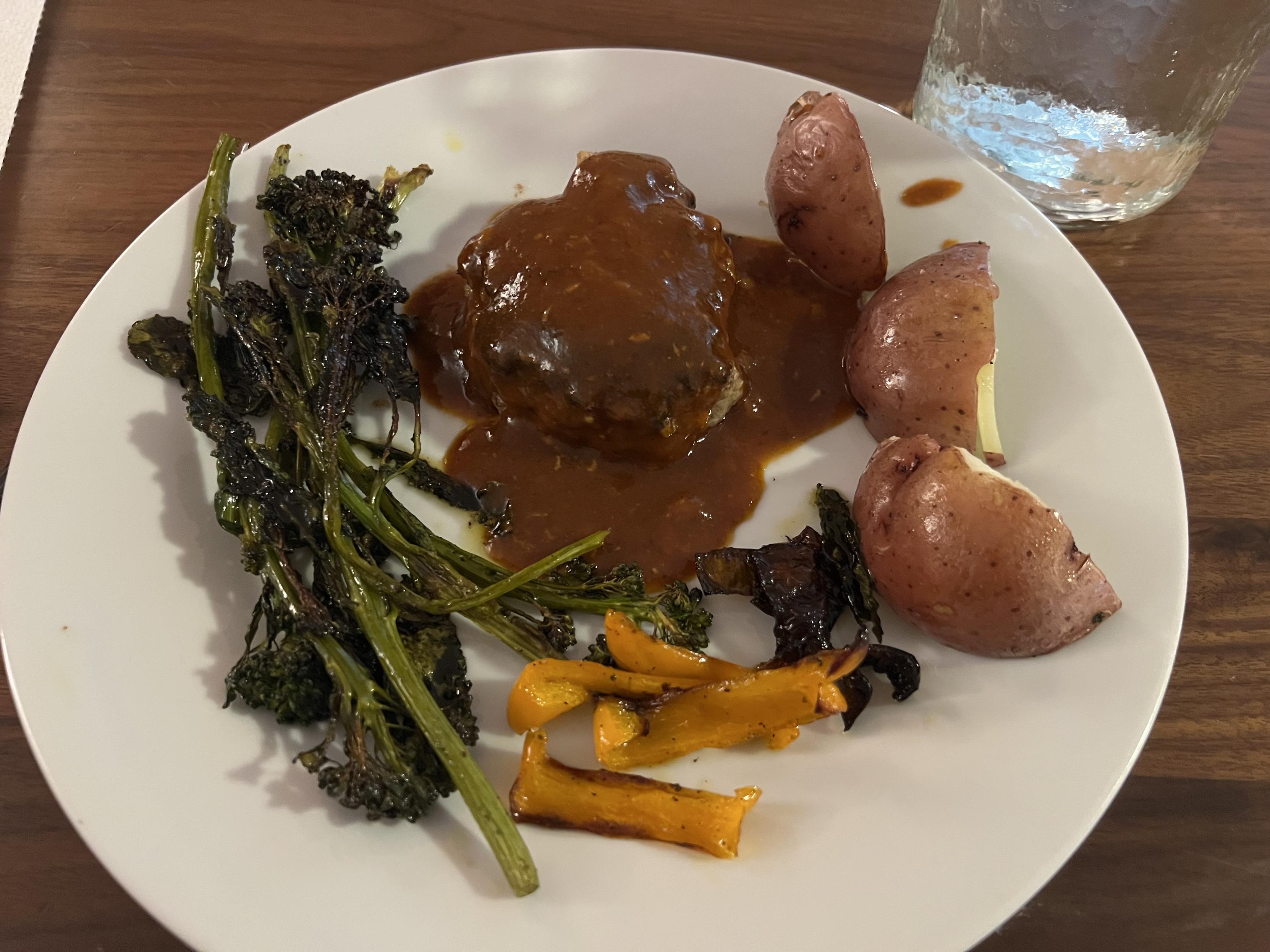 Japanese hamburger steak with roasted potatoes, broccolini, and bell peppers