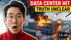 video card with an asian guy wearing glasses with his mouth open. in the background is a data centre being hit by bombs