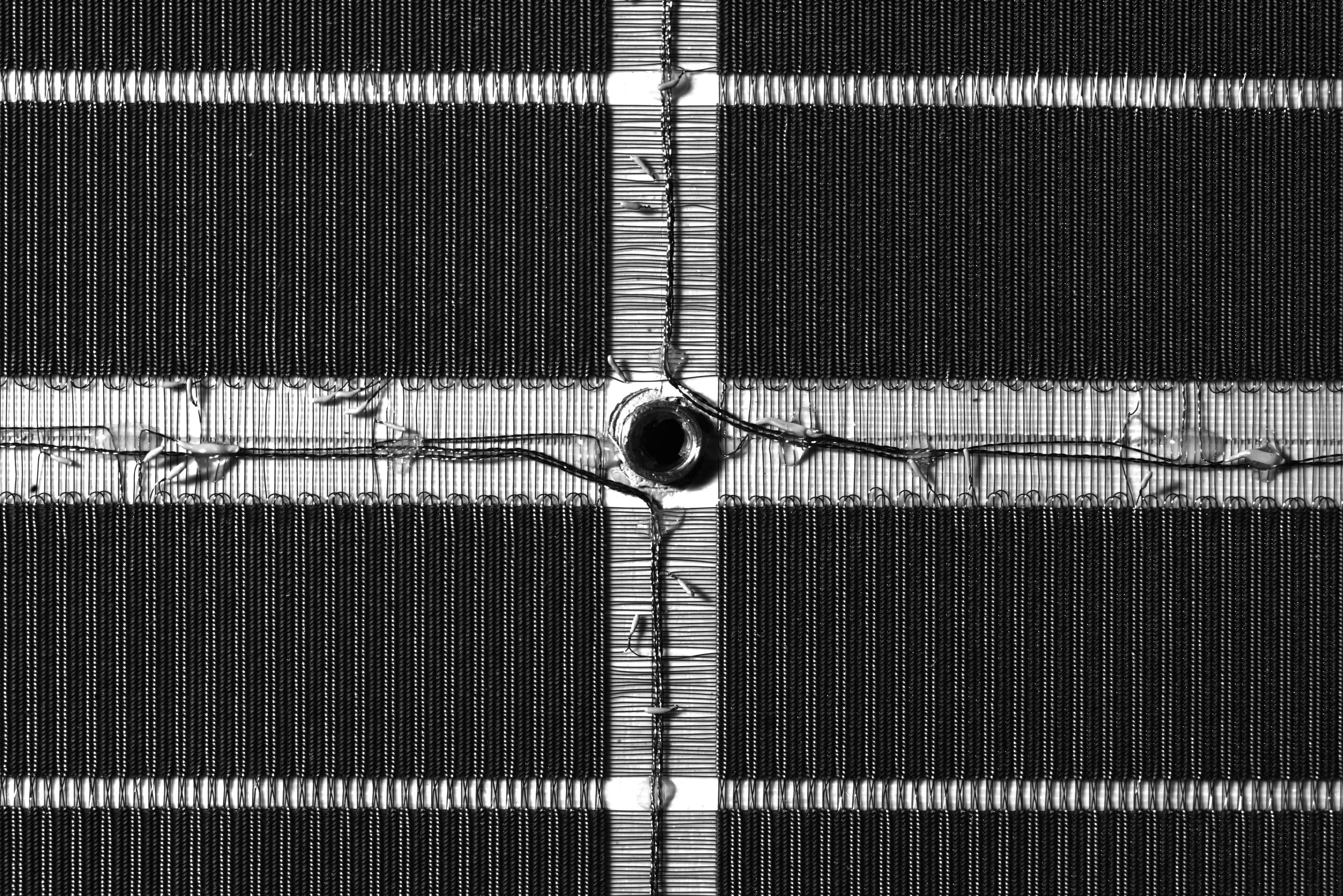 An abstract black and white closeup of core memory.