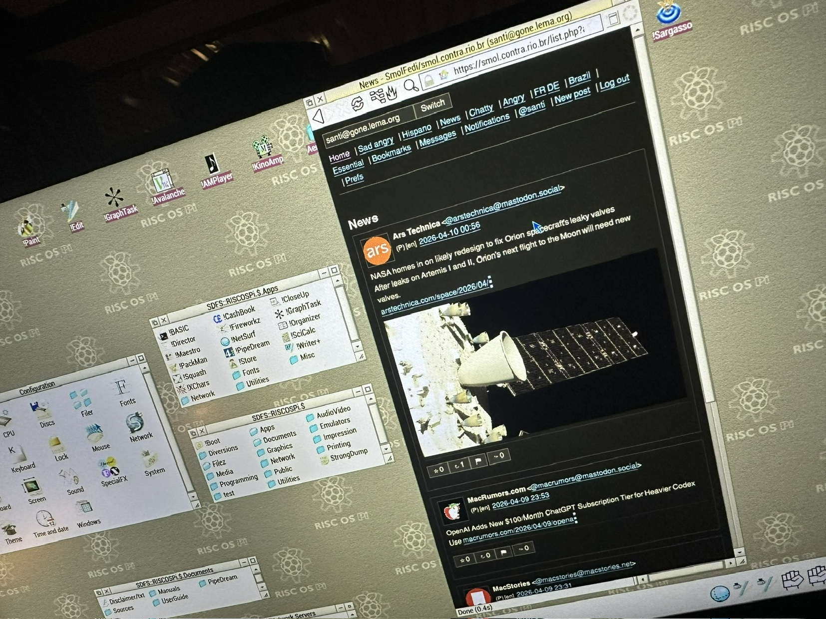 Screenshot of RiscOS. Along with desktop and file stuff is a NetSurf window showing a mastodon client