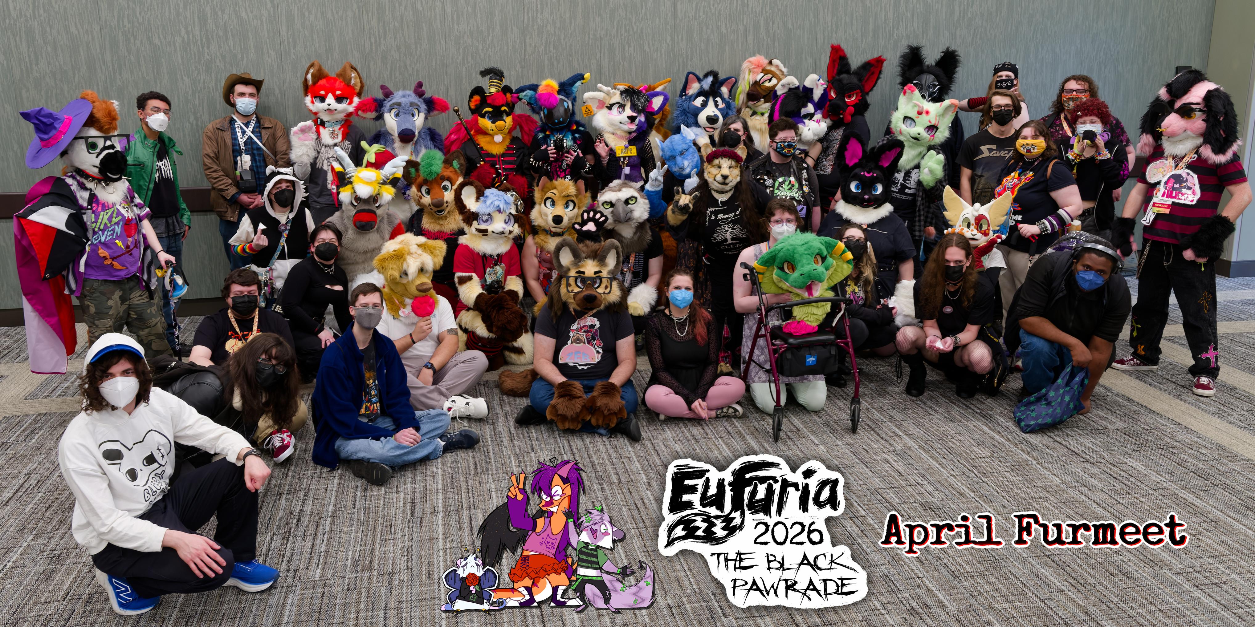 Group photo of about 50 people wearing face masks and fursuits at the furmeet. Captioned: Eufuria 2026 The Black Pawrade April Furmeet with chibi drawings of Joy, Herkimer, and Seymour