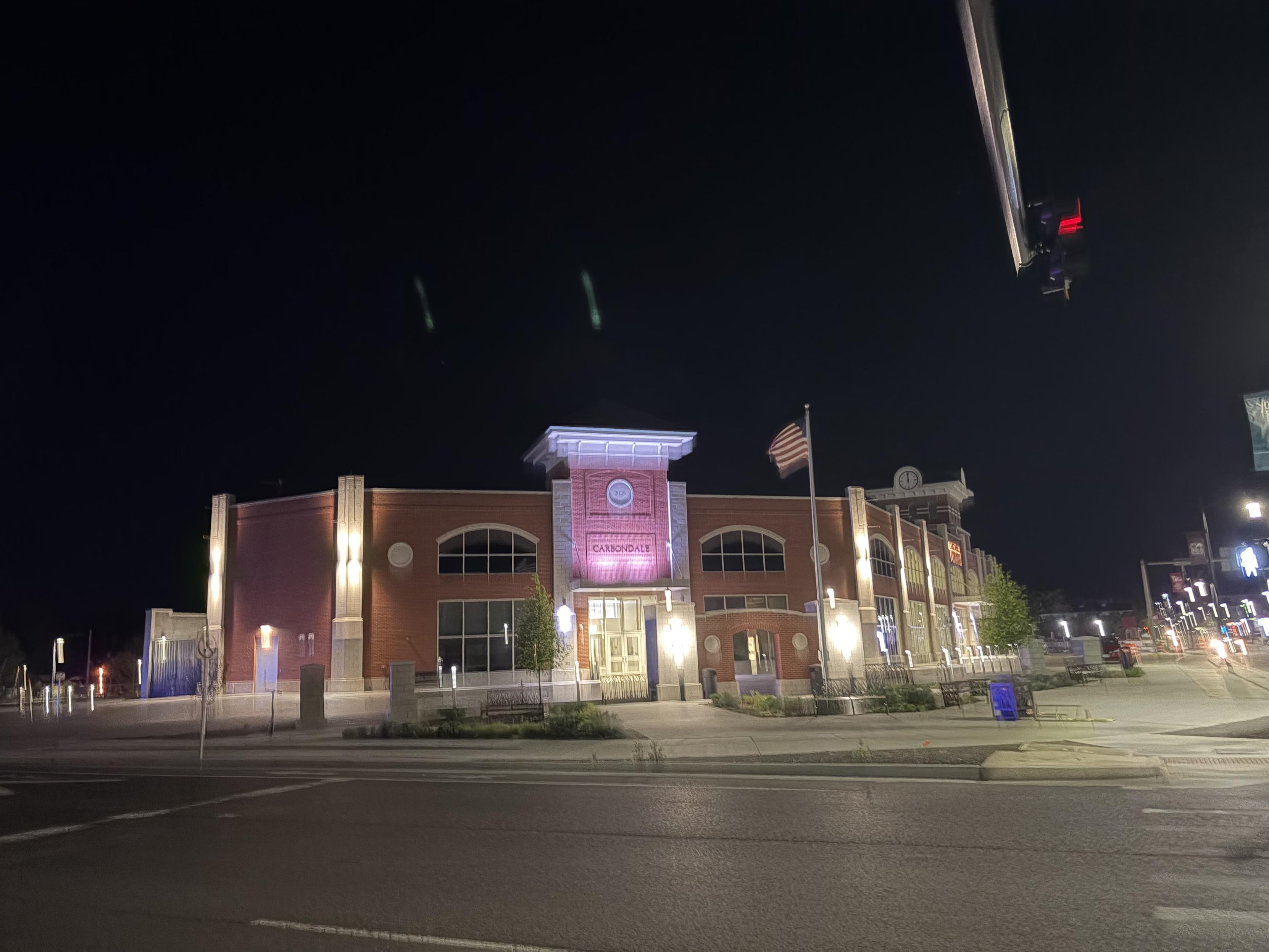 Blurry photo of the train station in Carbondale, IL at night, taken while running towards it.